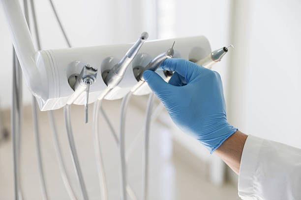 Professional Tooth Extraction technician working in Caldwell, TX